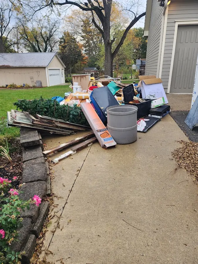 Dumpster being loaded with debris for Estate Cleanout Dumpster Rental in Maxatawny